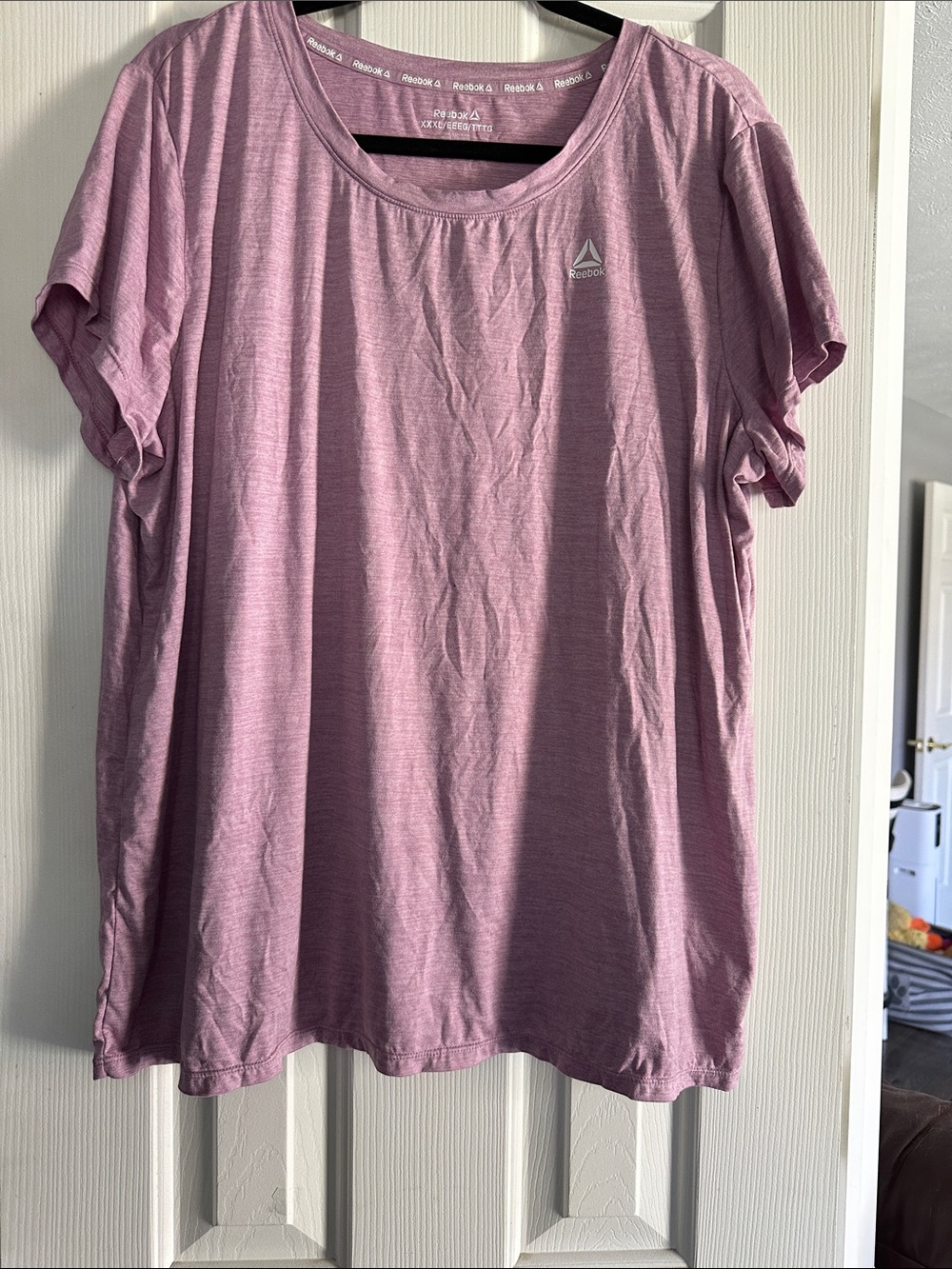 Reebok Women's Heathered Light Pink Short-Sleeve Active Tee.